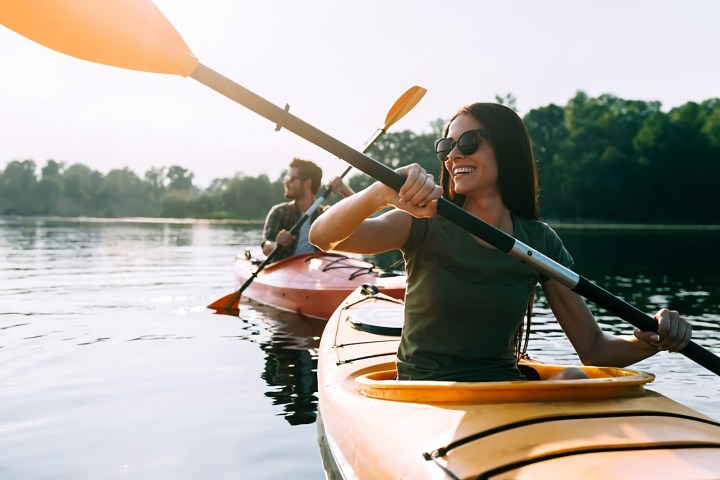 a person rowing a boat in a body of water