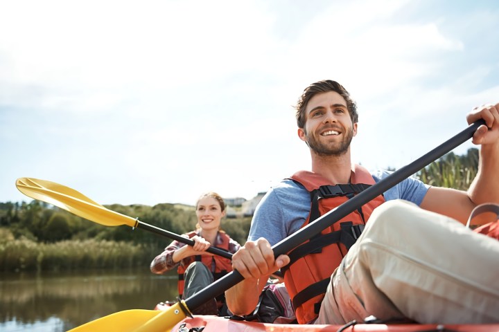 a person riding on the back of a boat