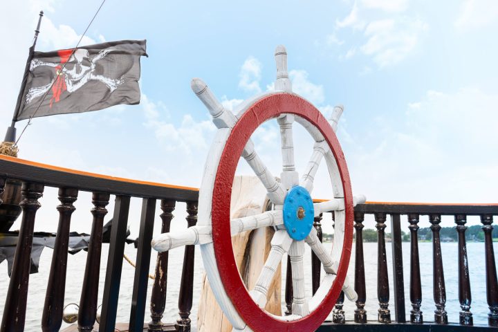 a large jetliner sitting on top of a wooden fence