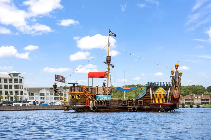 a boat is docked next to a body of water