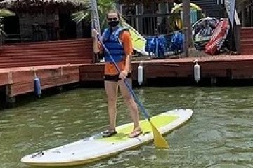 a person riding on the back of a boat