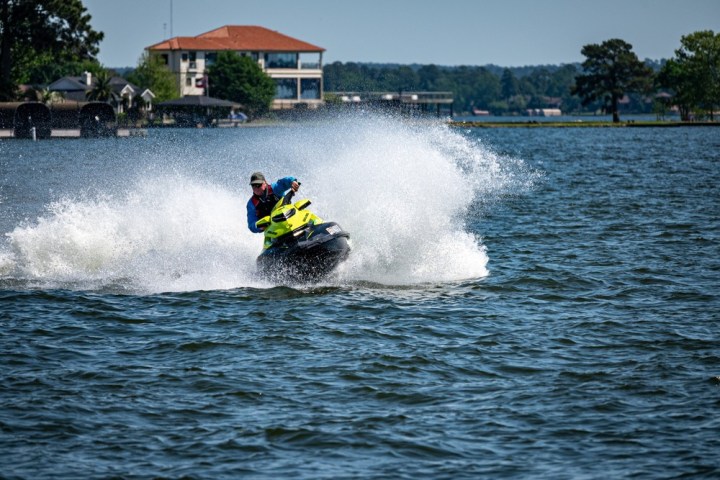a man water skiing behind a boat