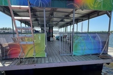 a boat that is sitting on a dock next to a body of water